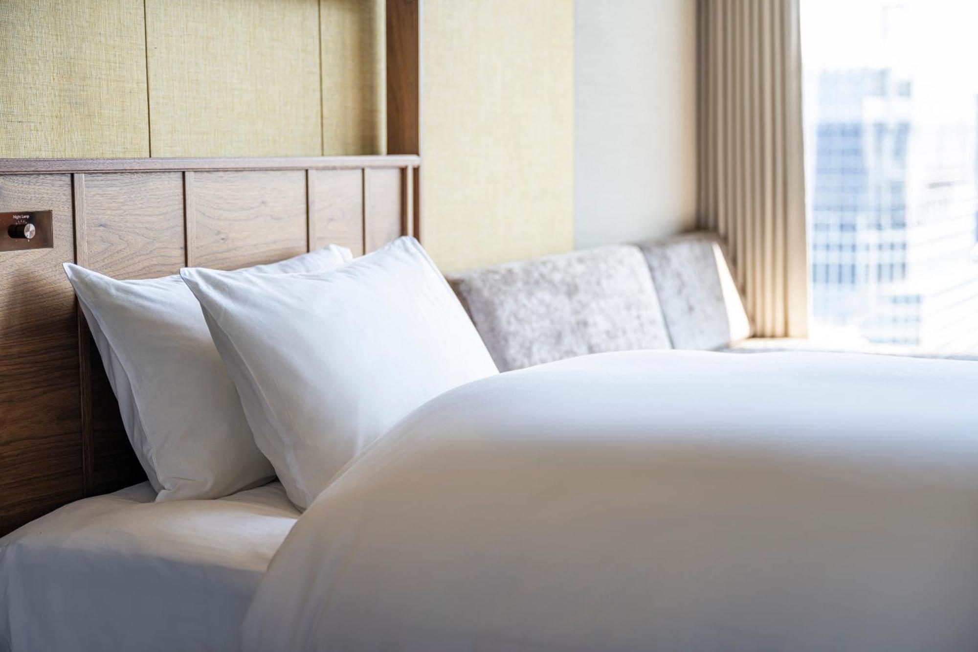 Candeo Hotels Osaka The Tower Bilik gambar A bed with pillows